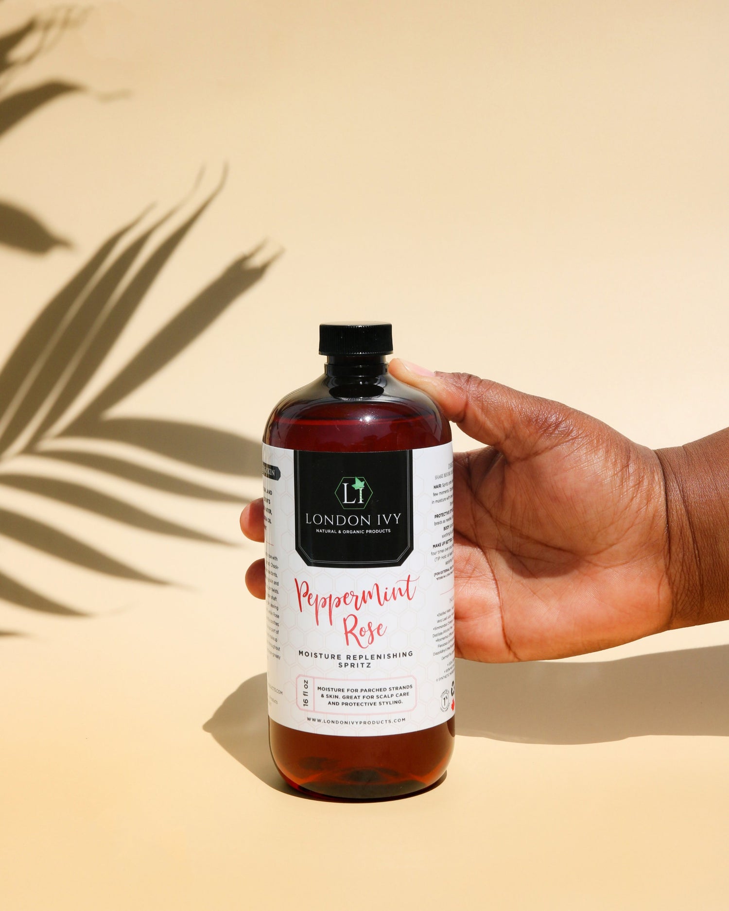 Peppermint Rose Refresher spray Refill  photo with hand reaching to hold it