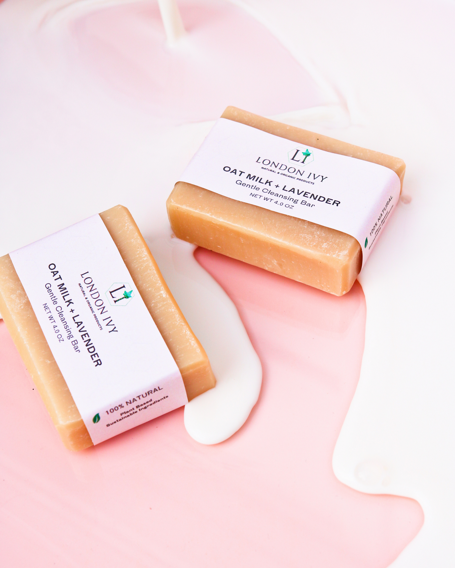 oat milk + lavender cleansing soap bar with oat milk pouring and going around the bar